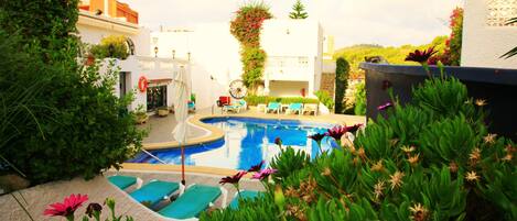 Outdoor pool, pool umbrellas, pool loungers