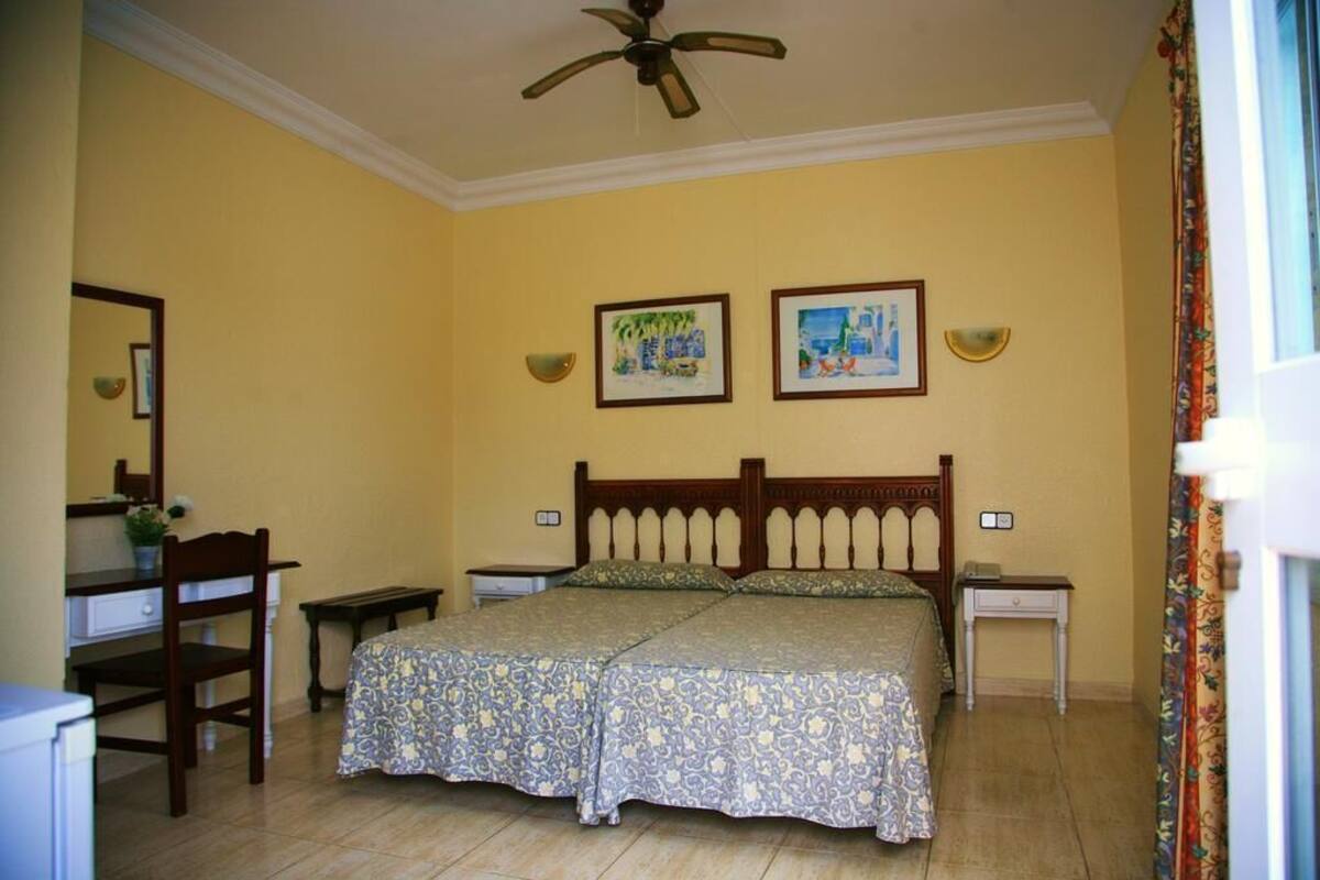 Desk, blackout curtains, bed sheets