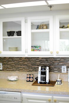 Premium bedding, in-room safe, individually decorated at Cove Inn on Naples Bay