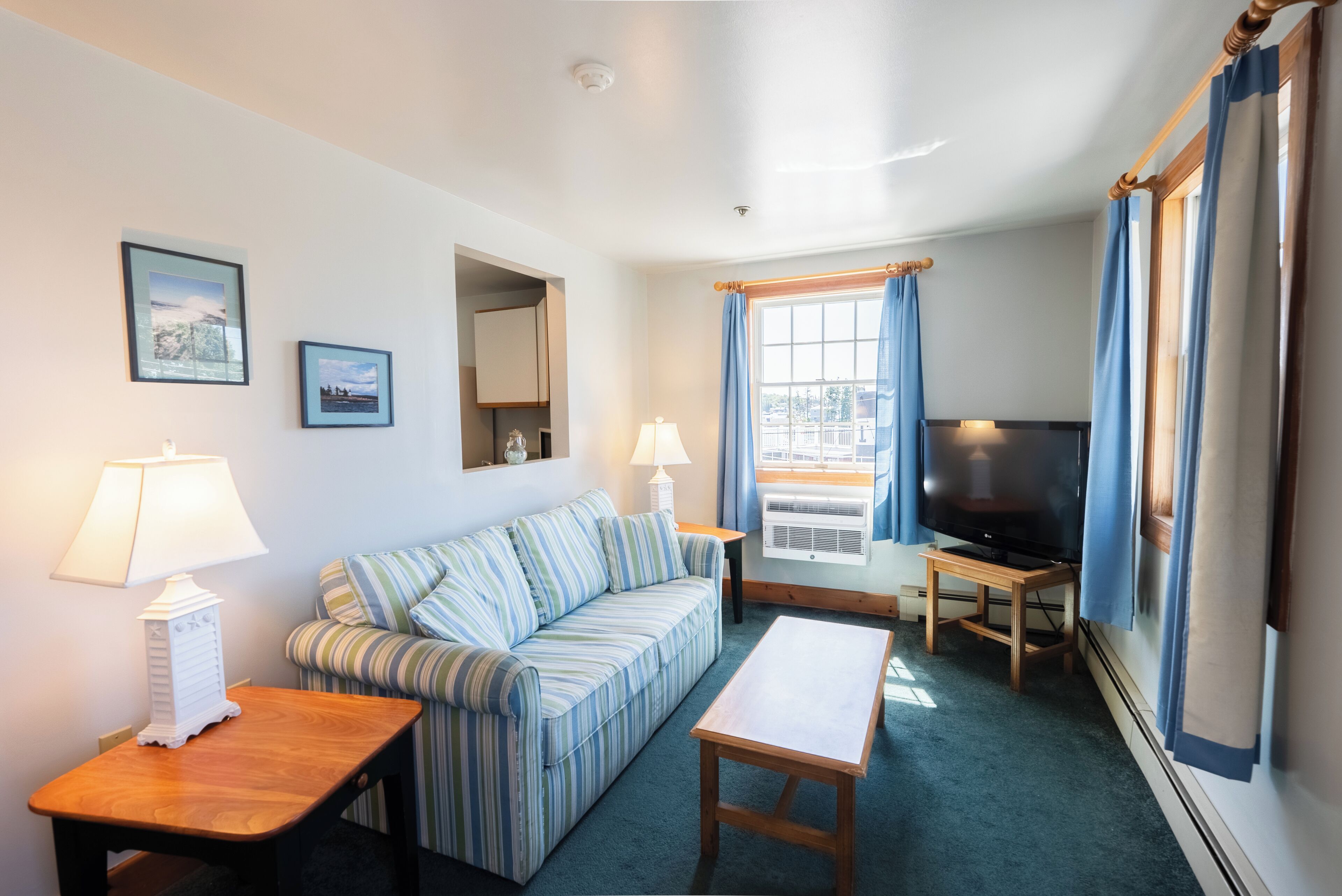 two queens main inn suite (clipper suite) | living area | 42-inch flat-screen tv with cable channels, tv