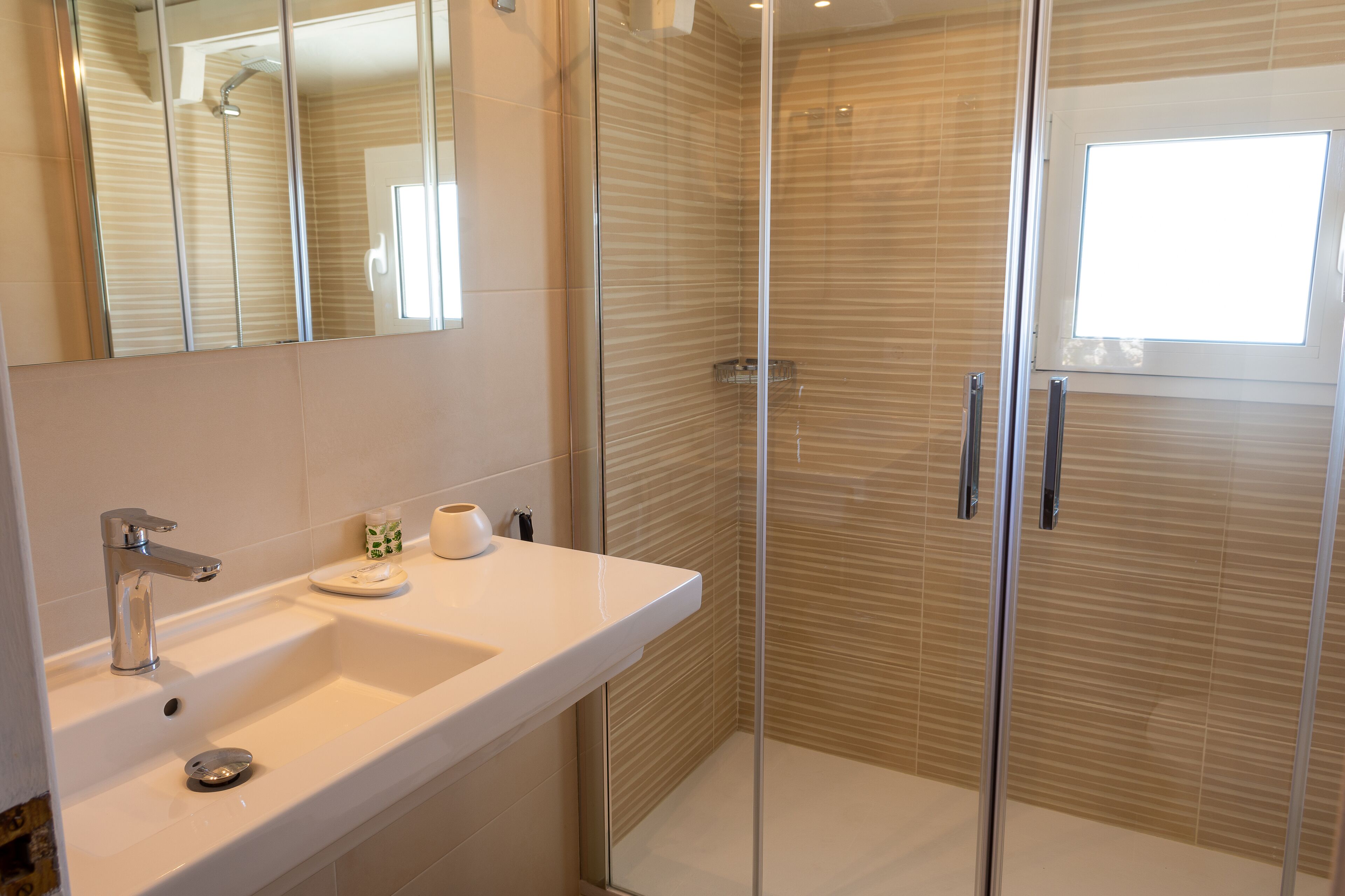 family suite | bathroom | bathtub, hair dryer, towels, soap