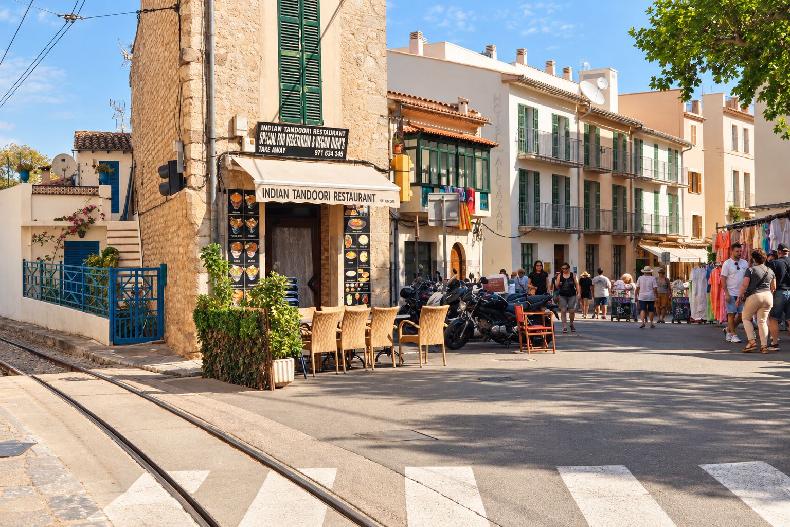 A street view with a restaurant named 'Indian Tandoori Restaurant' offering vegetarian and vegan dishes.