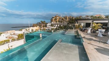 2 outdoor pools, open 10:00 AM to 6:00 PM, pool umbrellas, pool loungers