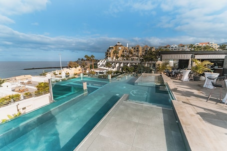 2 outdoor pools, open 10:00 AM to 6:00 PM, pool umbrellas, pool loungers. Los Olivos Beach Resort