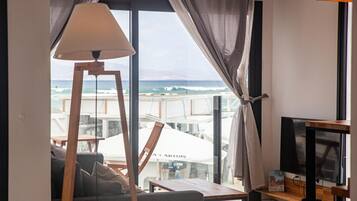 Premium Apartment, 1 Bedroom, Sea View | Living room | Flat-screen TV