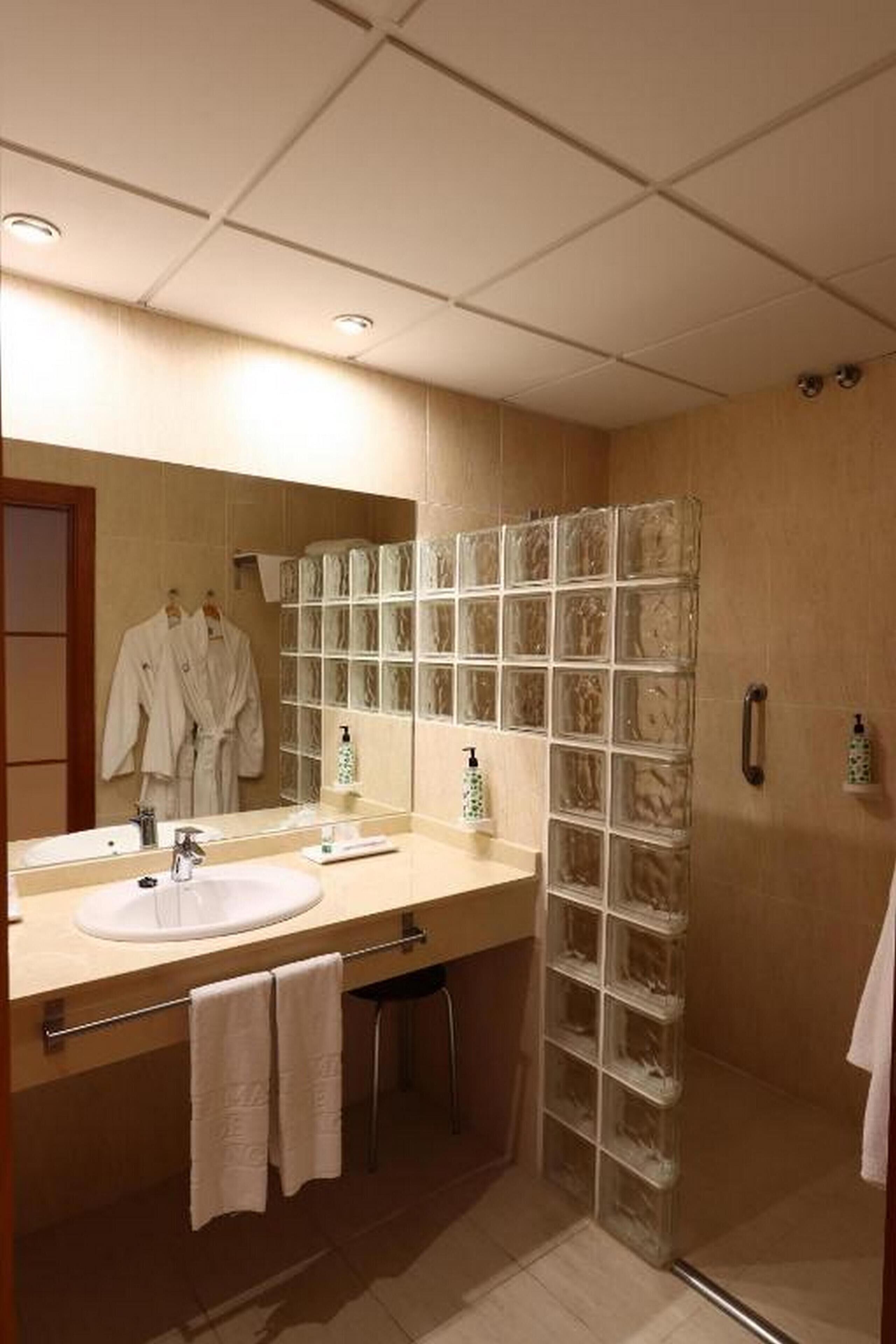 shower, free toiletries, hair dryer, bathrobes