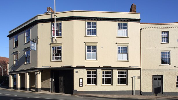 A corner building with a flat facade, multiple windows, and a visible entrance. - The Crown & Thistle, Abingdon, Oxfordshire – Acorn Pubs (Abingdon)