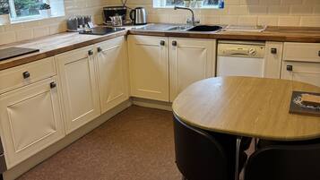 Apartament Deluxe, amb bany privat | Cuina privada | Trona