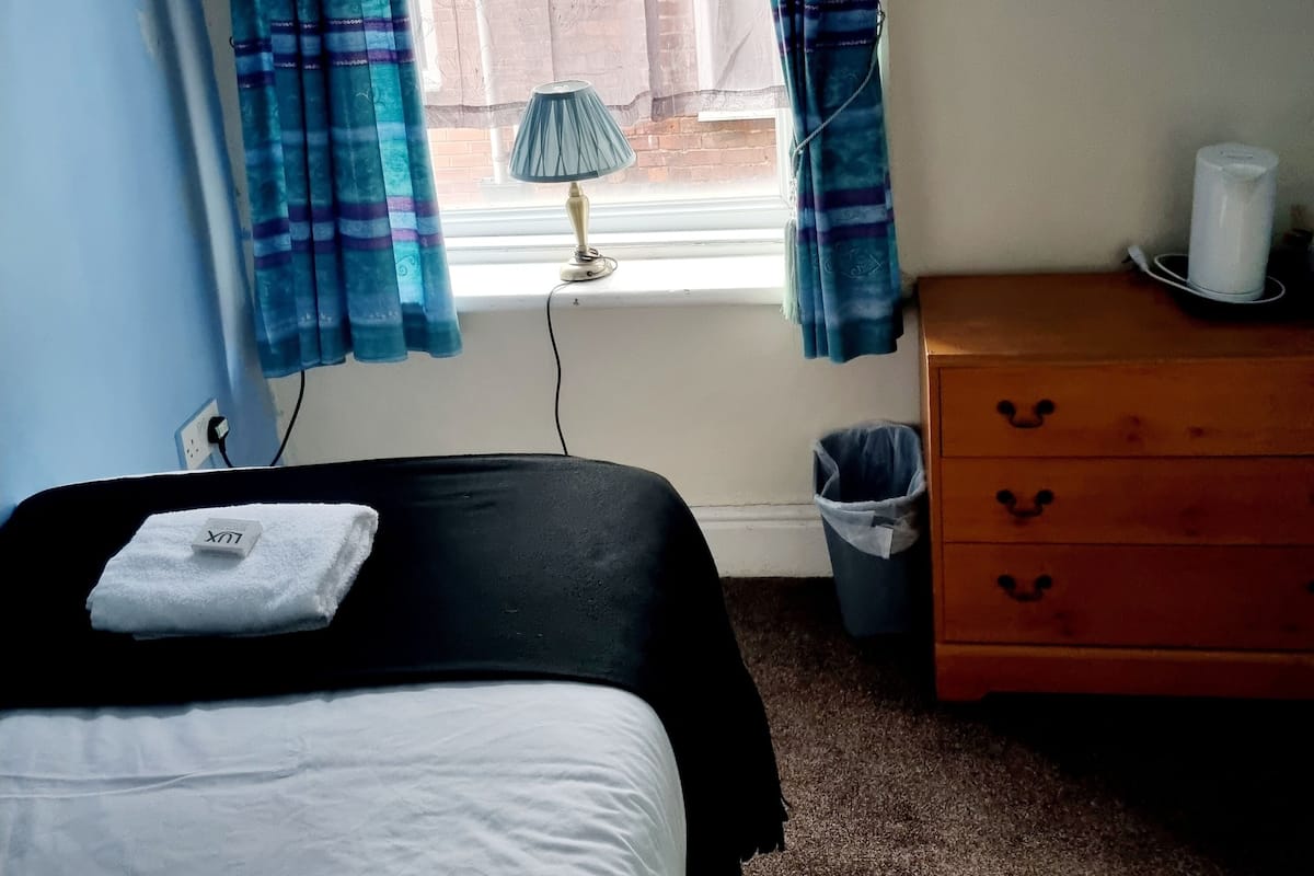Quarto solteiro, suíte