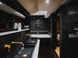 Deluxe Suite | Bathroom | Designer toiletries, hair dryer, towels, soap