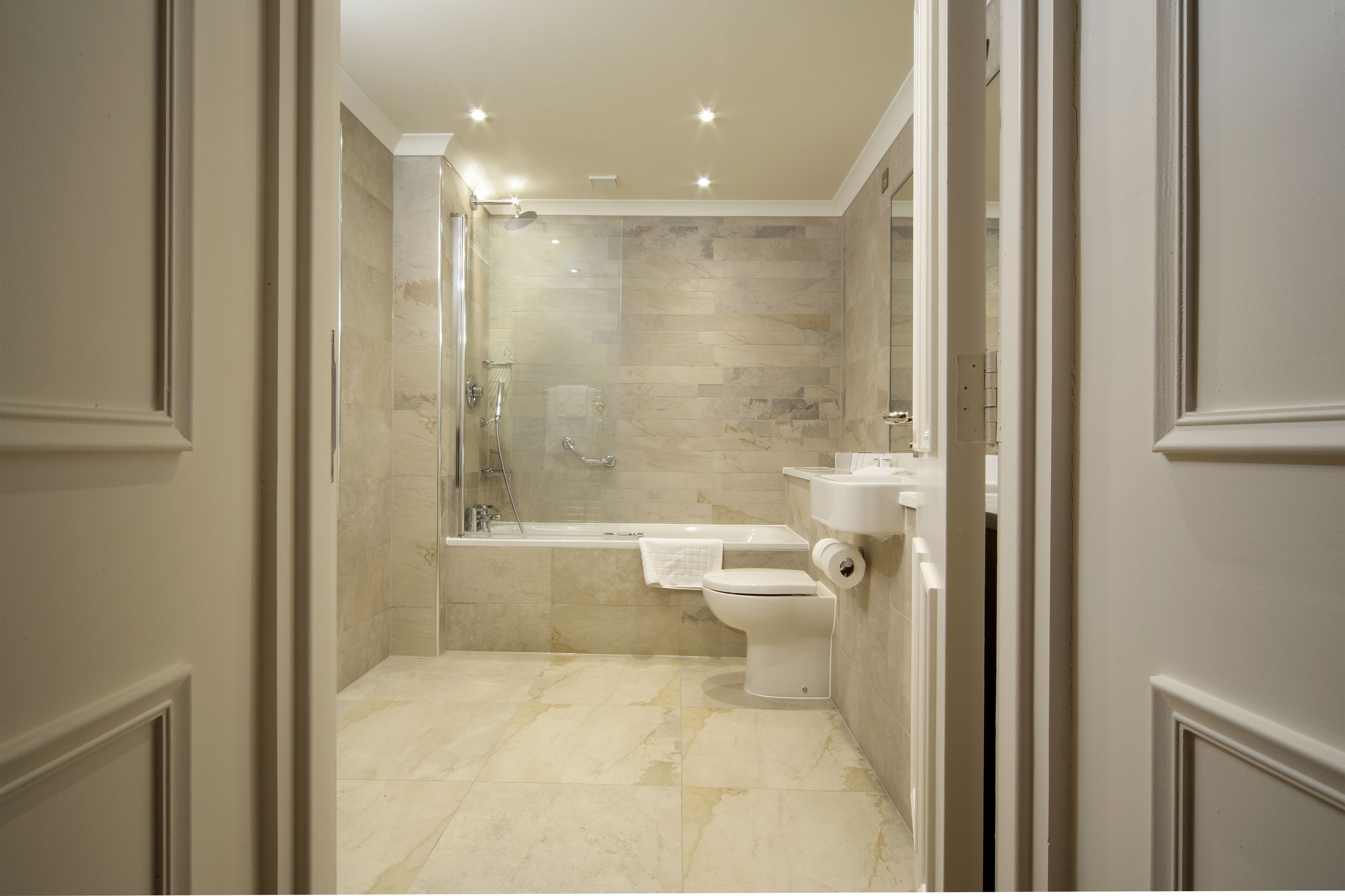 designer toiletries, hair dryer, towels