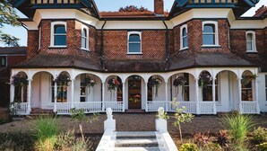 A large, two-story house with a symmetrical facade, multiple windows, and a central entrance with a white porch. - CIM Business Centre (Maidenhead)