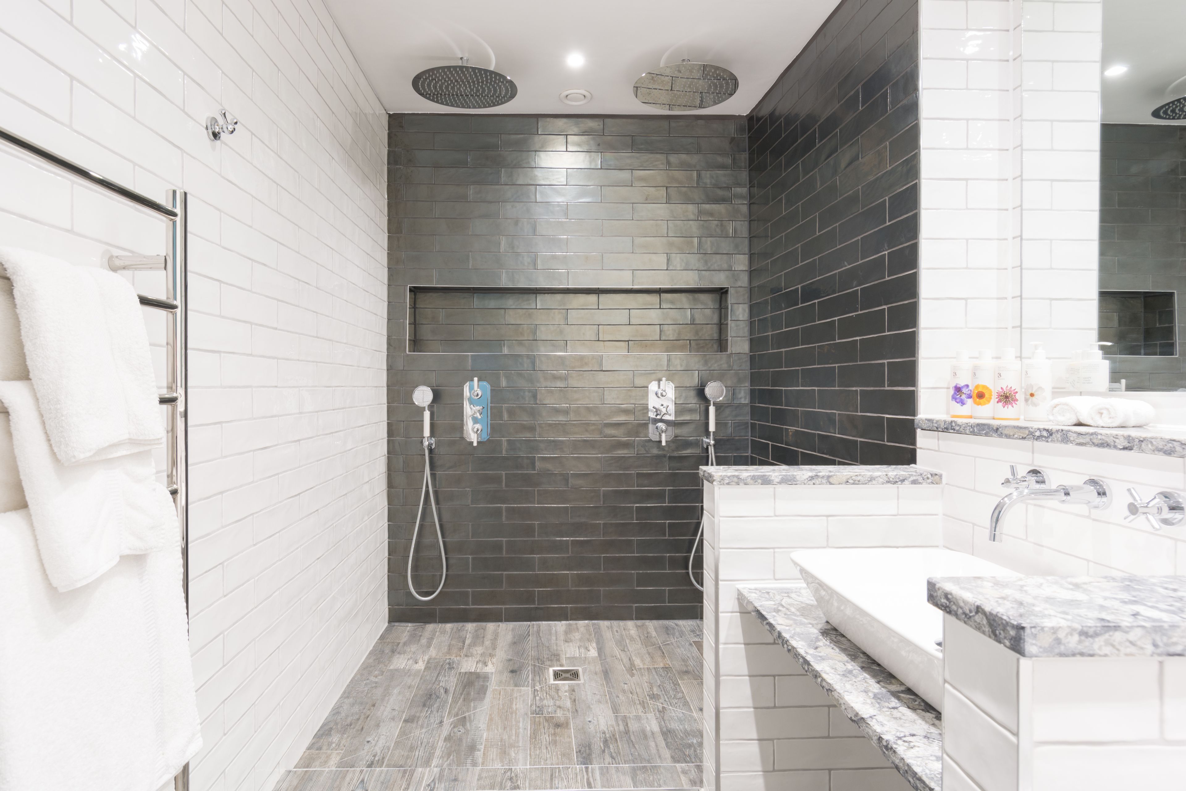 luxury suite, 1 queen bed, garden view | bathroom | free toiletries, hair dryer, towels