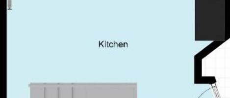 A floor plan with a kitchen area, a dining area, and a bathroom.