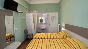 A hotel room with a bed, a desk, a television, a mirror, a sink, and a shower area. - Hotel Barone (Genoa)