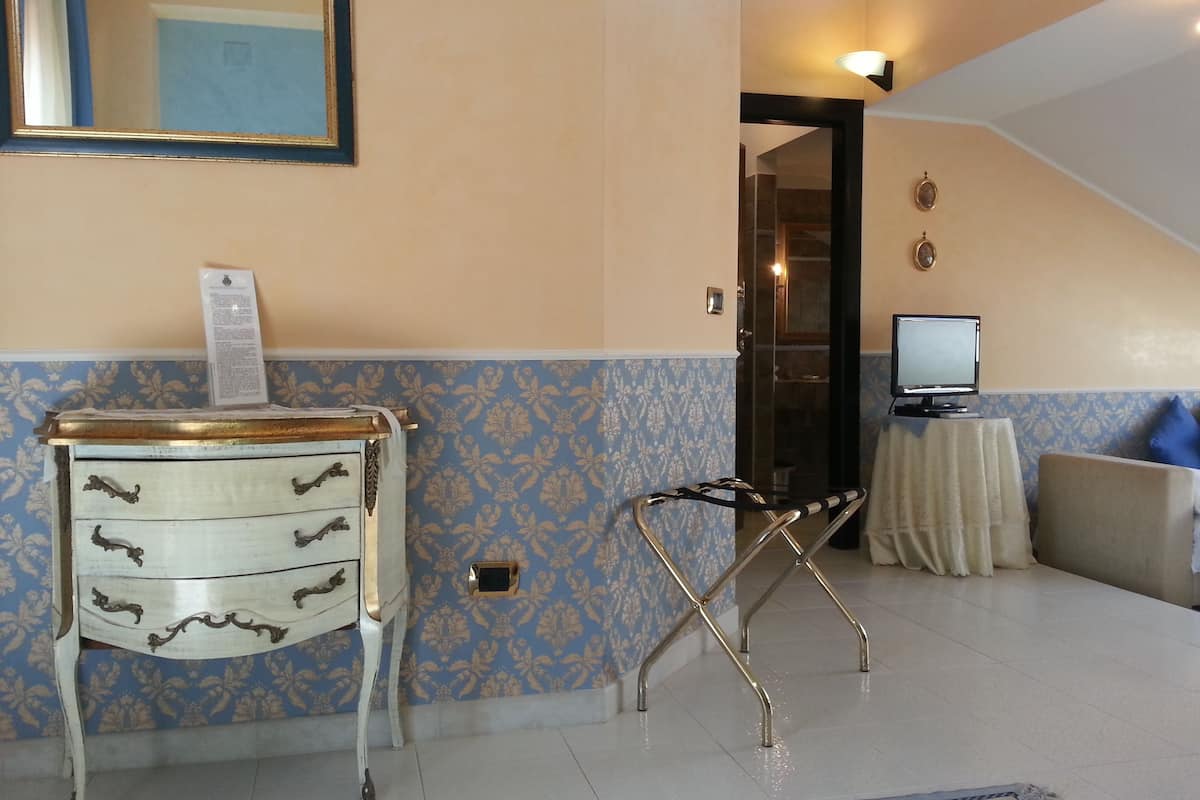 Superior Suite, Partial Ocean View | Living area | Flat-screen TV