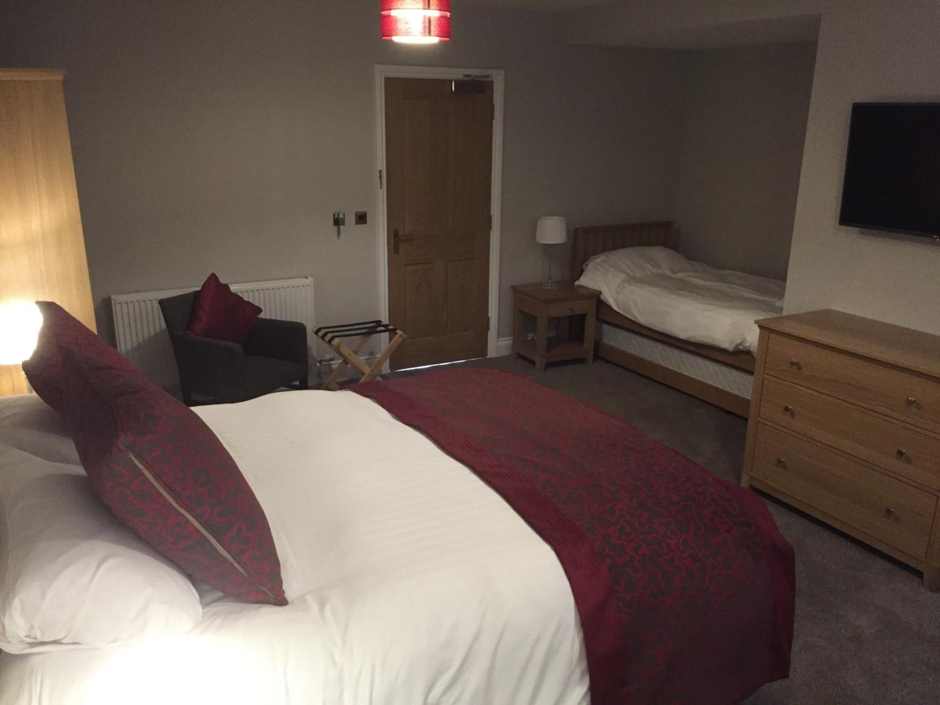 premium bedding, desk, laptop workspace, blackout curtains