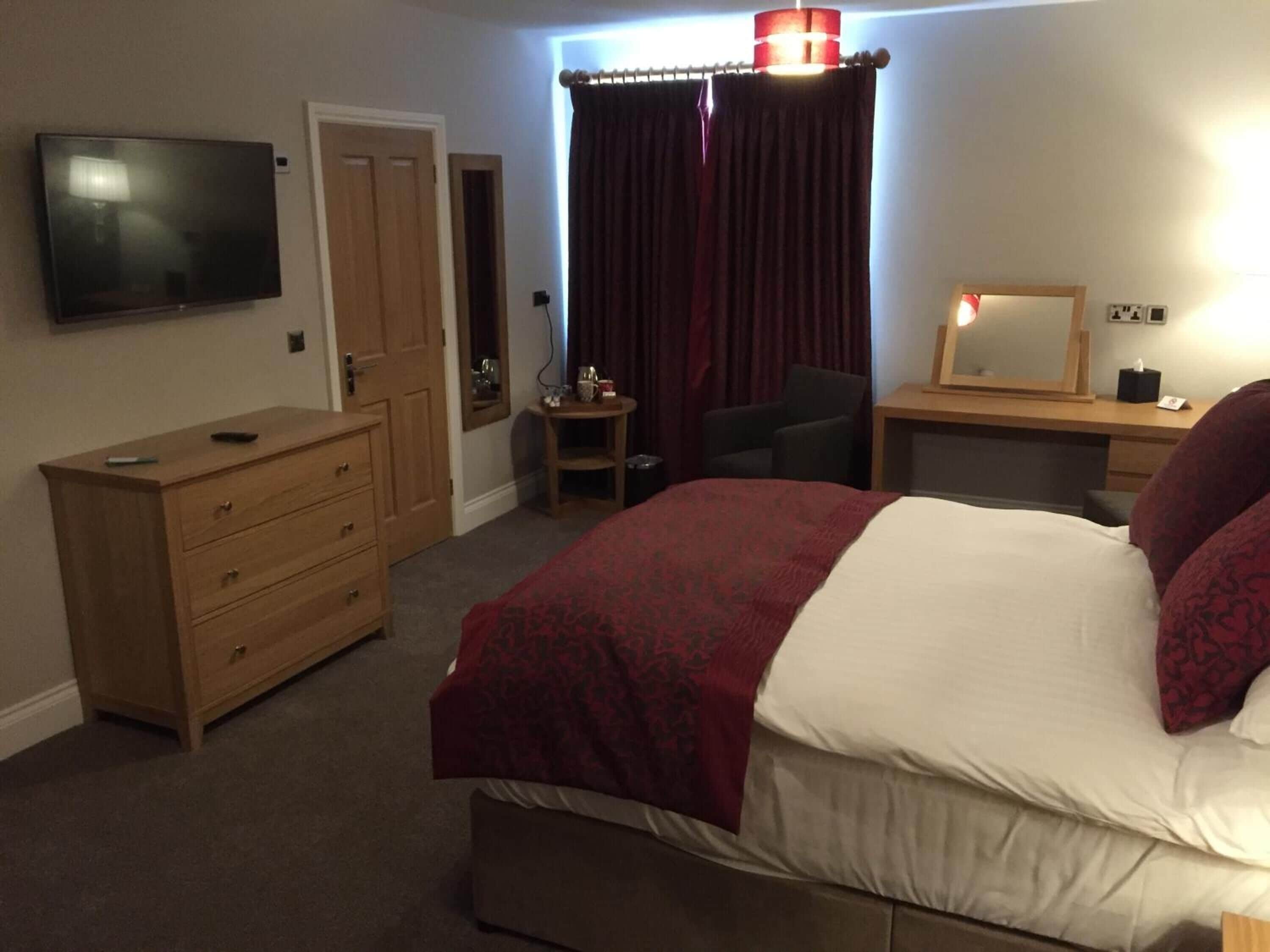 premium bedding, desk, laptop workspace, blackout curtains