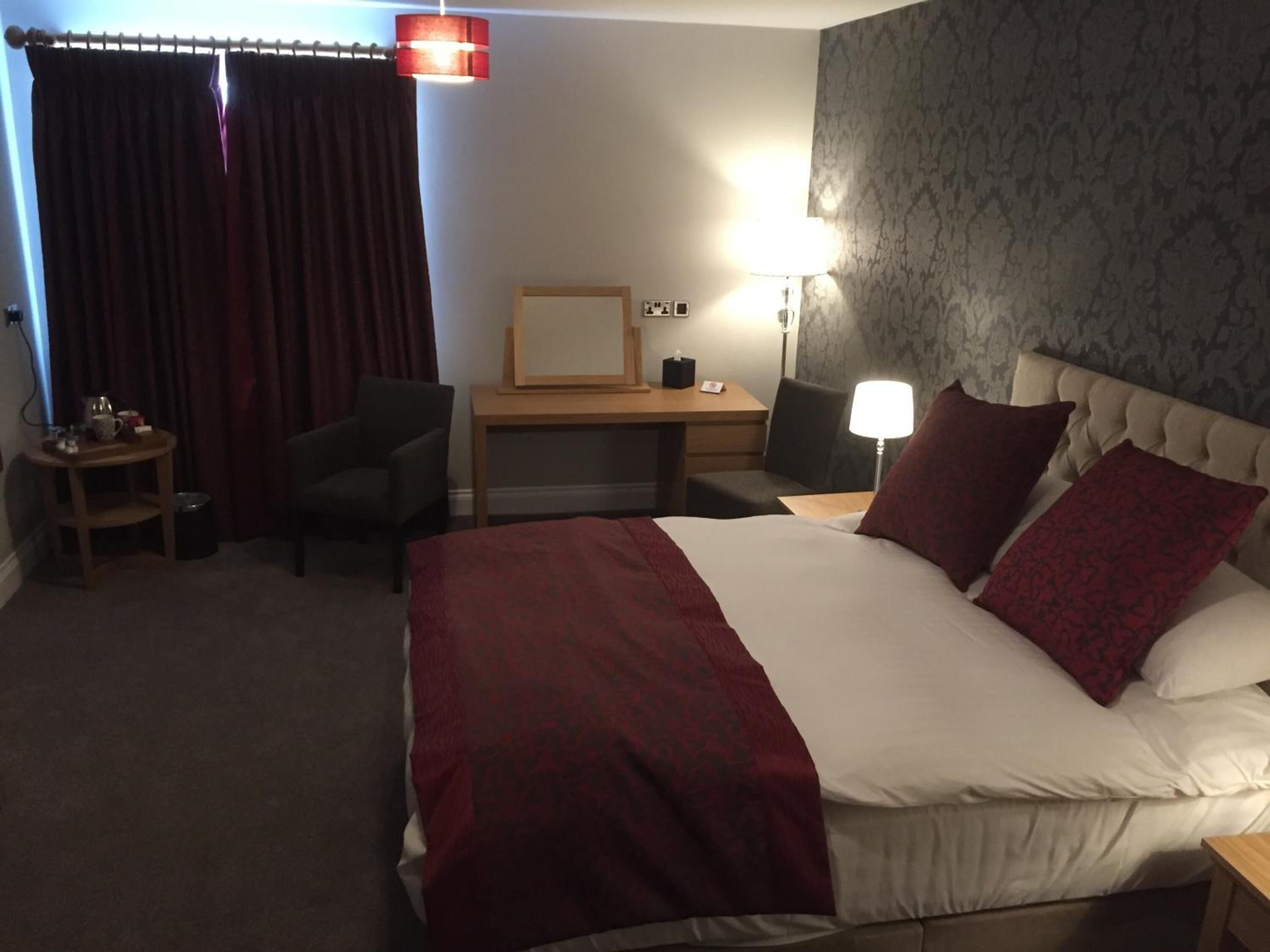 premium bedding, desk, laptop workspace, blackout curtains