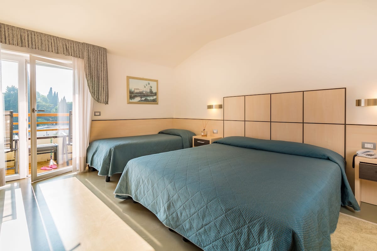 triple room, pool view | minibar, in-room safe, desk, free wifi