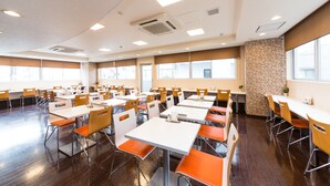 A spacious dining area with multiple tables and chairs, large windows, and a modern ceiling design. - Sanco Inn Shizuoka Kitaguchi (Shizuoka)