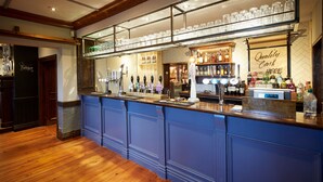 A bar area with a blue counter, multiple taps, and a sign reading "Quality Cash here". - Childwall Abbey, by Marstons Inns  (Liverpool)