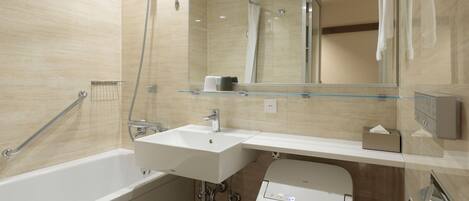 Un baño moderno con bañera, lavabo y ducha.