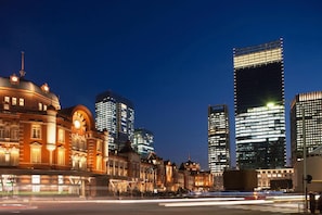 A cityscape at night with historic buildings and modern skyscrapers. - Olympic Inn Kanda (Tokyo)