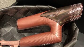 A pair of metallic, ribbed, curved objects in a woven basket.