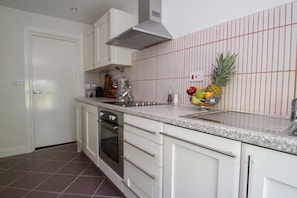 Executive Suite, 1 Bedroom (Second Floor Suite 5) | Private kitchen | Full-size fridge, microwave, oven, stovetop