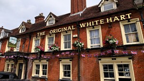 A traditional brick building with the sign "The Original White Hart" prominently displayed. - Original White Hart, Ringwood by Marston's Inns (Ringwood)
