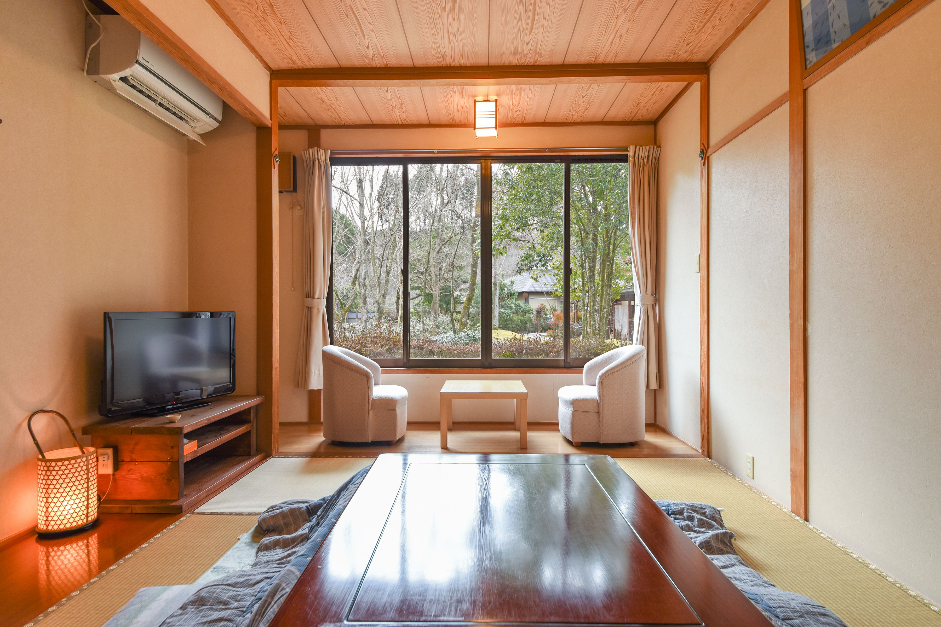 Desk, laptop workspace, iron/ironing board, bed sheets