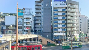 A modern hotel with multiple balconies and a prominent 'Hotel Cuore' sign.