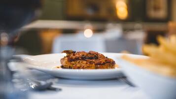 A plate of food on a table with a blurred background.