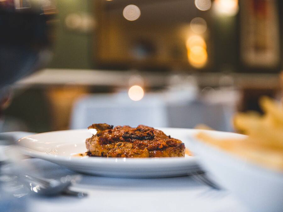 A plate of food on a table with a blurred background.