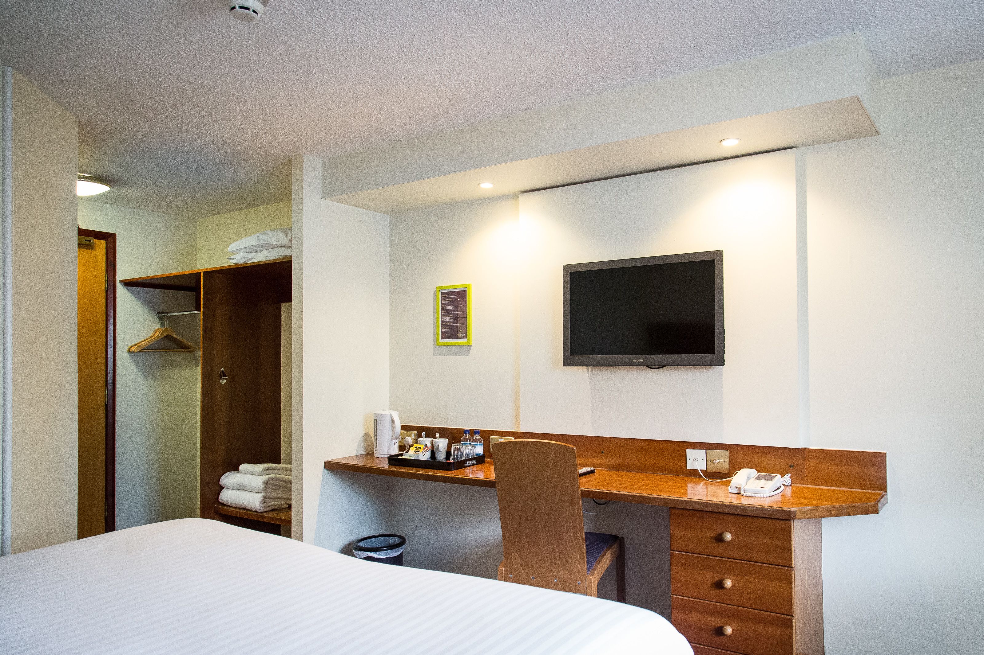 family room | 1 bedroom, desk, blackout curtains, iron/ironing board