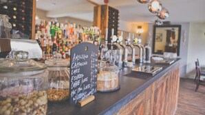A coffee bar with a chalkboard menu listing various drinks and their prices. - The Peel Aldergate (Tamworth)