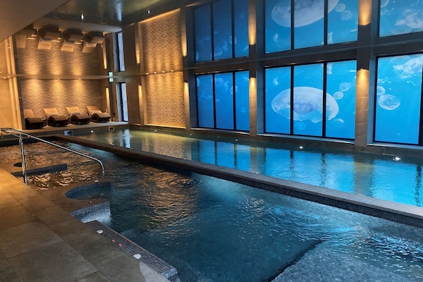 Indoor pool, seasonal outdoor pool, pool umbrellas, pool loungers