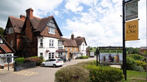 A traditional building with a signboard advertising "Two for One" and "Come on in!" for pub accommodation. - Heart of England, Northampton by Marston's Inns (Northampton)