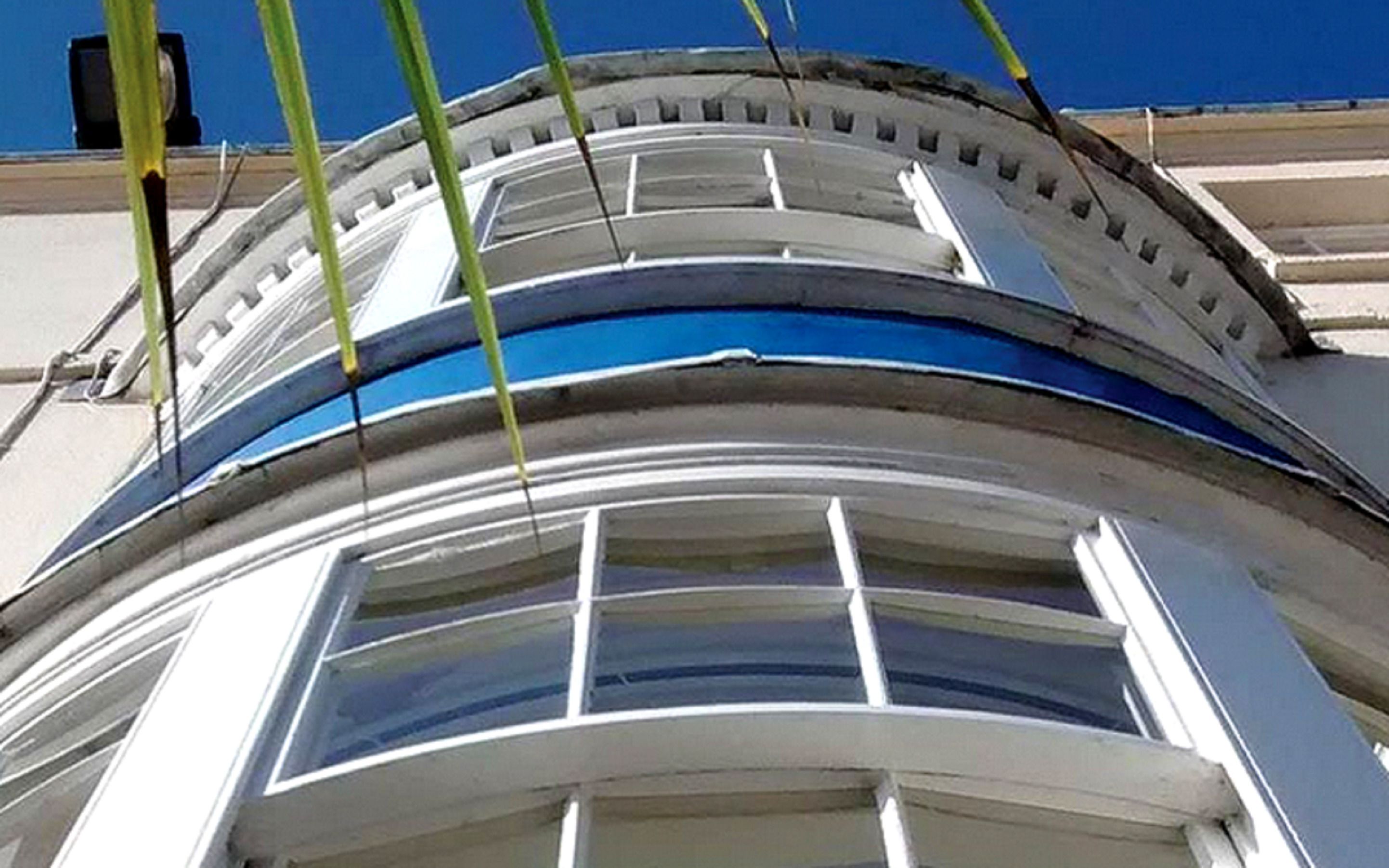 A curved architectural feature with a series of windows.