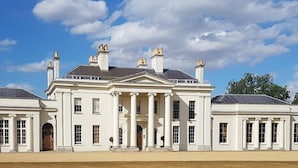 A large, white, classical-style building with symmetrical architecture, featuring multiple chimneys, large windows, and a central entrance. - The New Chichester Hotel (Wickford)