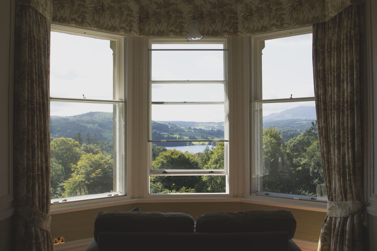 superior double room, lake view | in-room safe, desk, iron/ironing board, free wifi