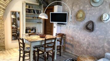 Apartment, 1 Bedroom, Terrace | Living area | 55-inch Smart TV with satellite channels, TV