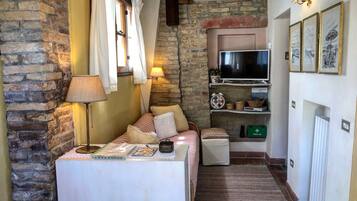 Apartment, 1 Bedroom, Terrace | Living area | 55-inch Smart TV with satellite channels, TV