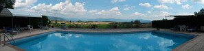 Outdoor pool, a rooftop pool, pool loungers