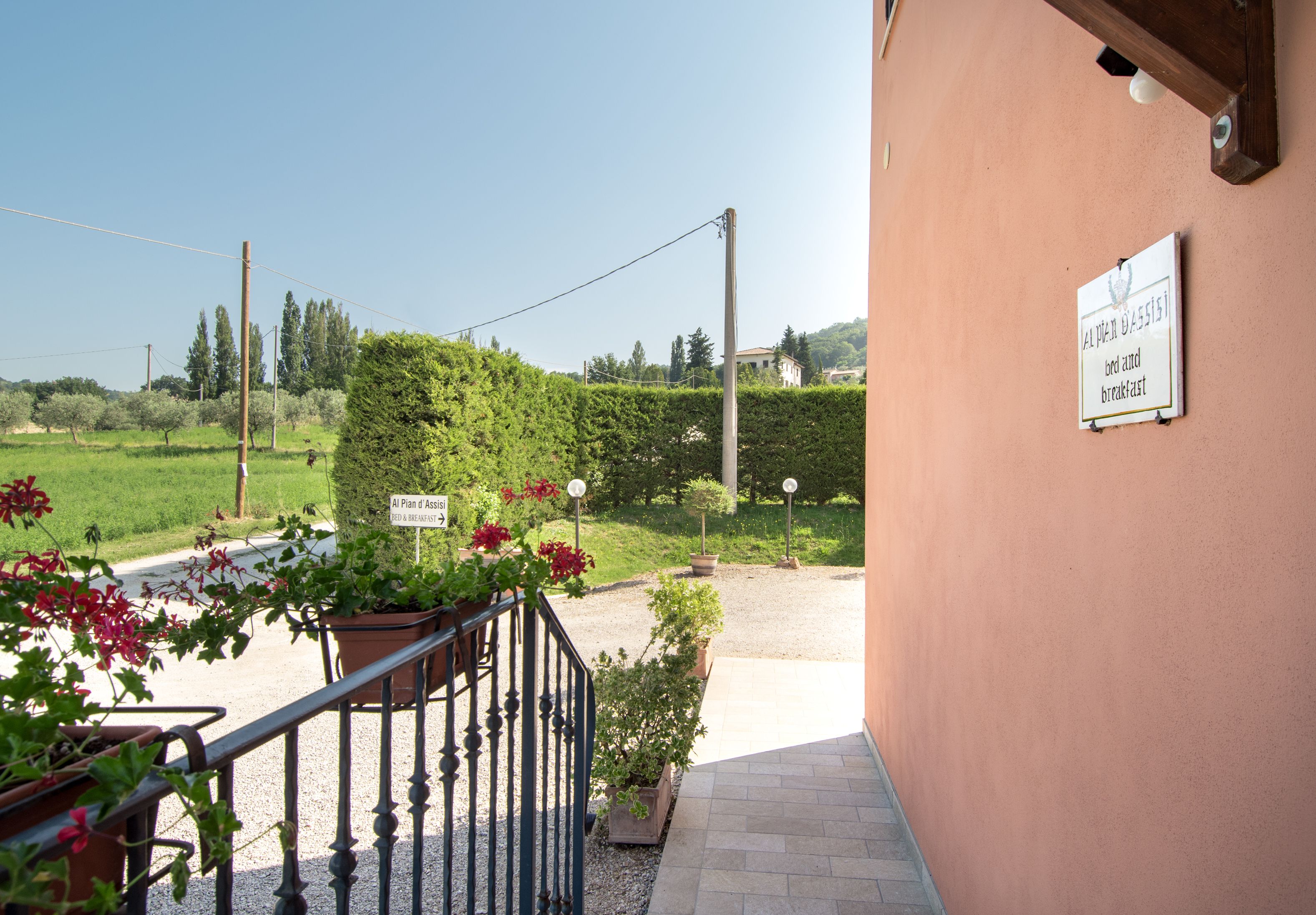 A hotel entrance with a sign indicating breakfast is included.