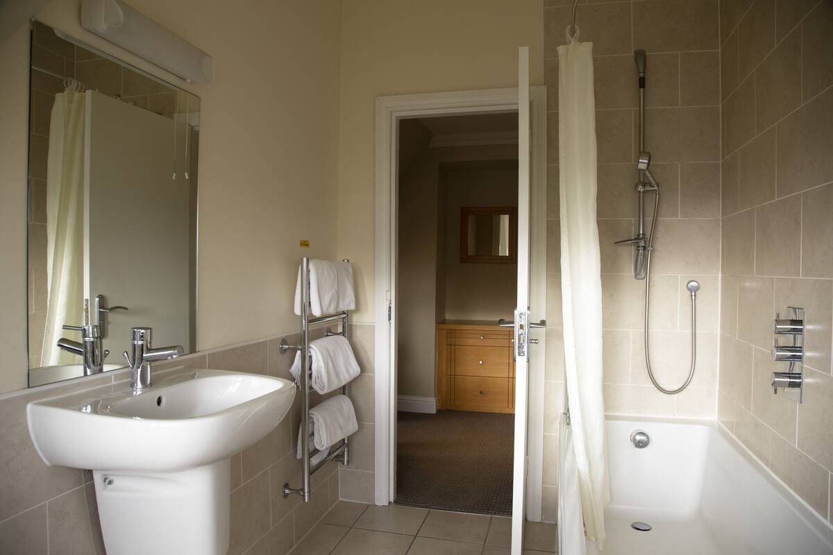 family room | bathroom | deep-soaking bathtub, towels