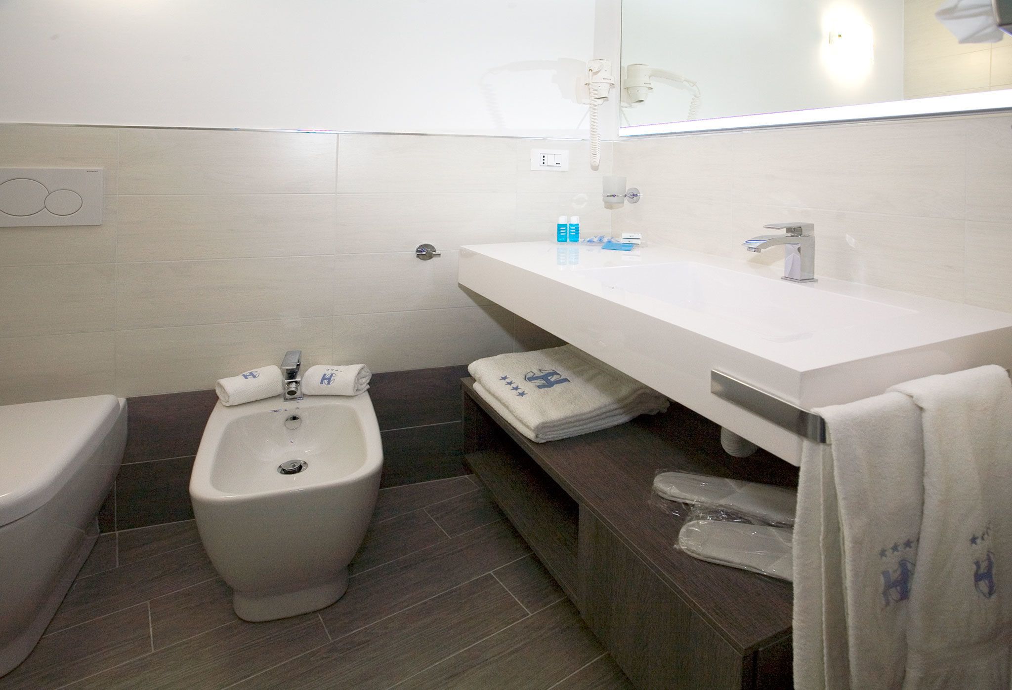 free toiletries, hair dryer, slippers, bidet