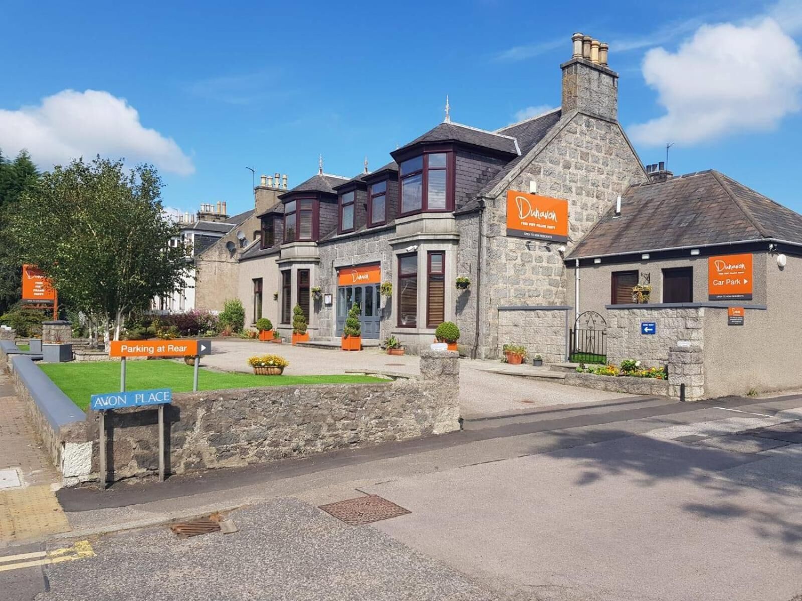 A stone building with a sign for 'Dunavon Car Park' and 'Dunavon'.