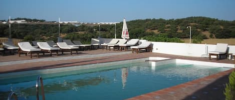 Seasonal outdoor pool, pool loungers